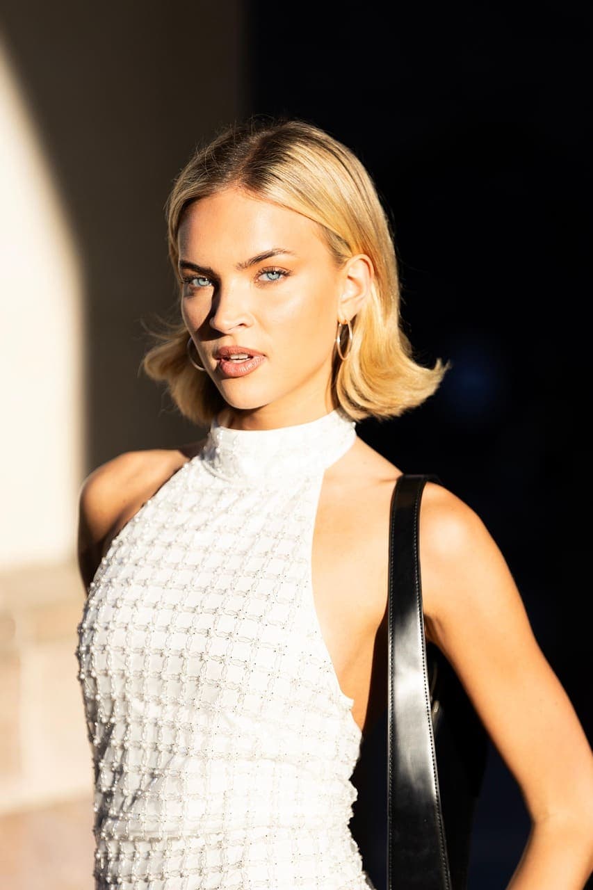 Guest with a sleek blonde chin-length bob