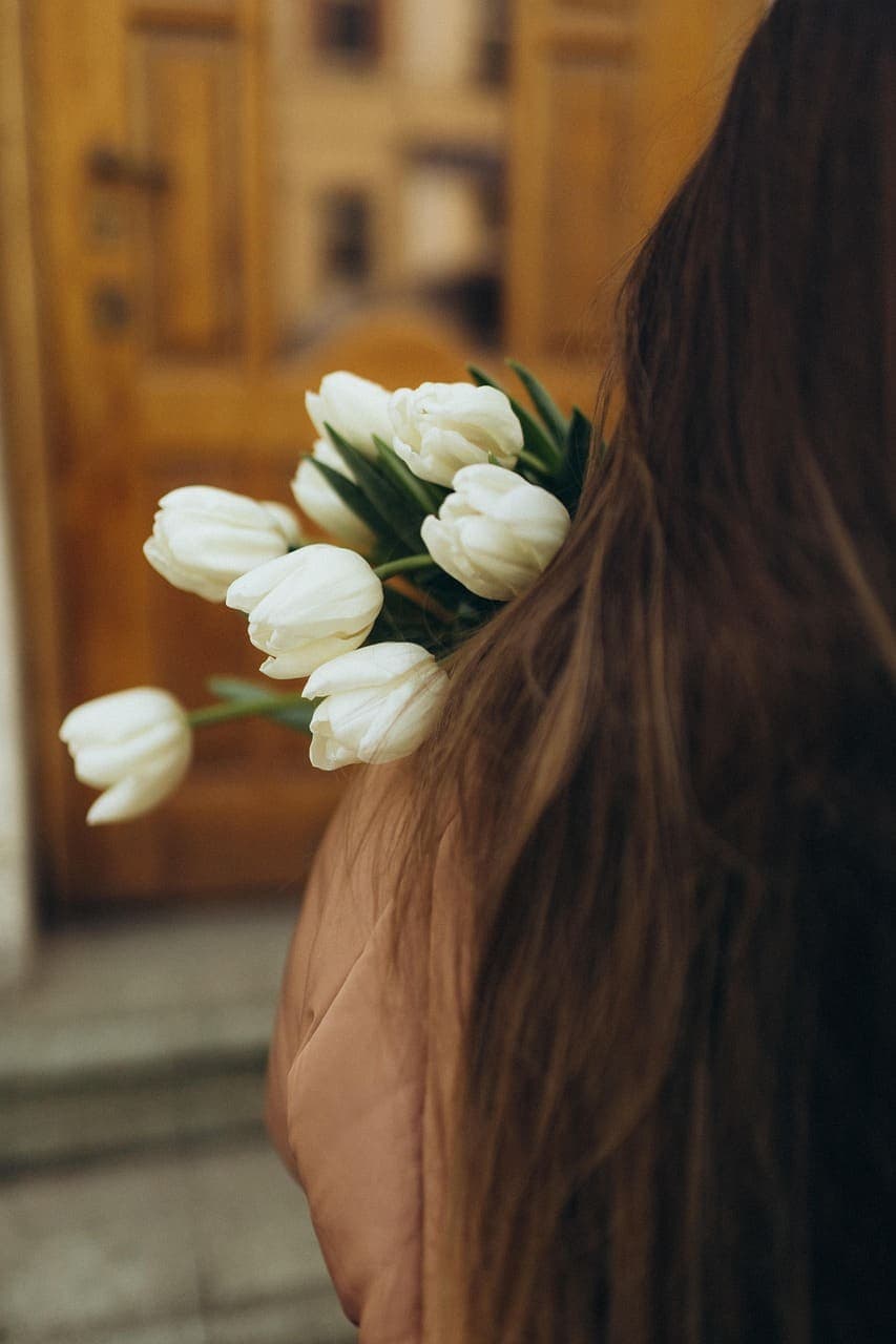 Long brunette hair with soft honey lengths, seen from behind